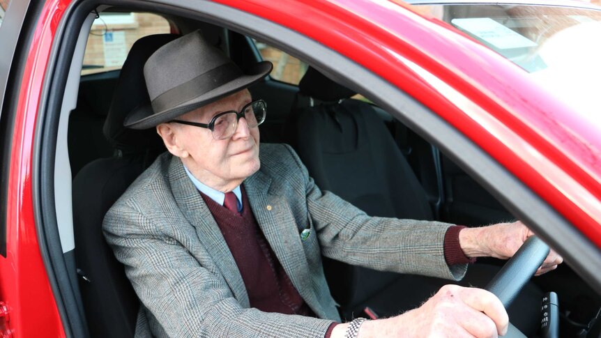 Elderly driver Max Hill behind wheel