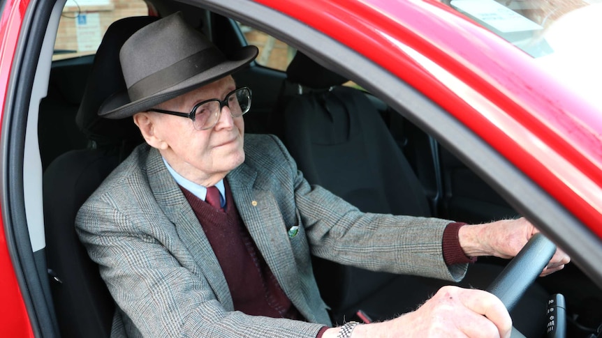 Elderly driver Max Hill behind wheel