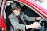 Elderly driver Max Hill behind wheel