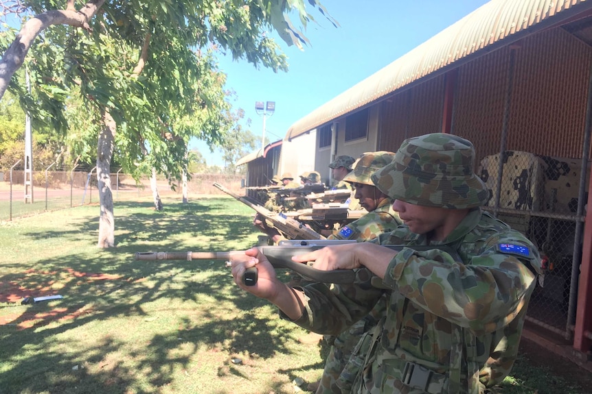 Norforce graduates learn how to use rifles as part of their training course.