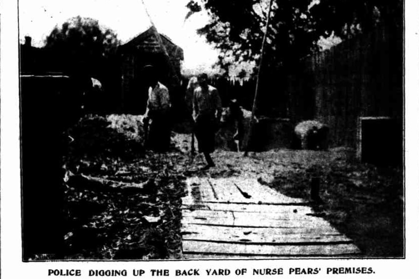 A black-and-white old photograph of a backyard being raided.