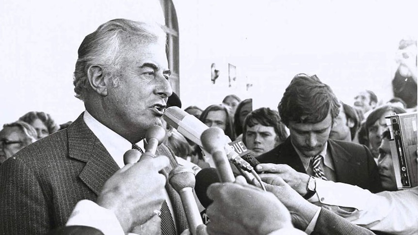 Gough Whitlam speaks into microphone on steps of Parliament House after the dismissal