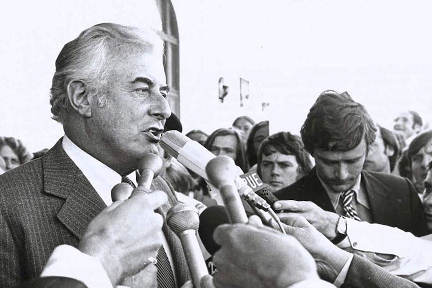 Gough Whitlam speaks into microphone on steps of Parliament House after the dismissal