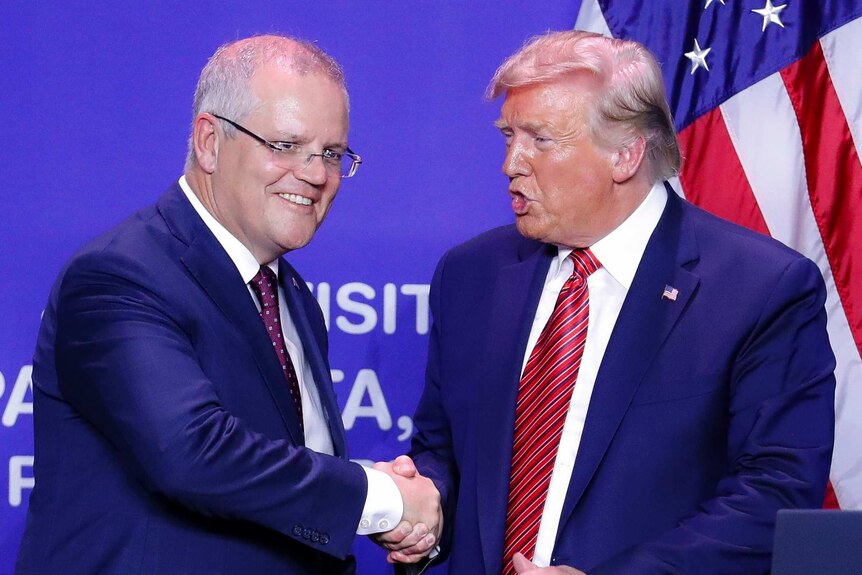 Donald Trump and Scott Morrison shake hands on stage