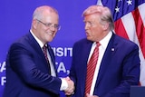 Donald Trump and Scott Morrison shake hands on stage