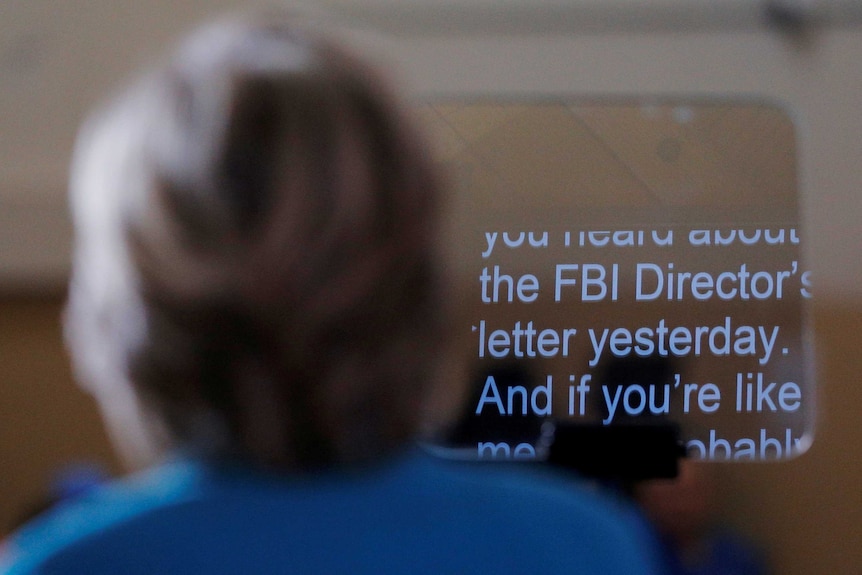 Hillary Clinton follows a teleprompter script regarding the FBI email probe