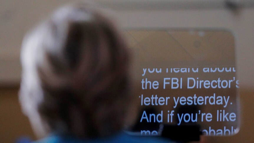 Hillary Clinton follows a teleprompter script regarding the FBI email probe