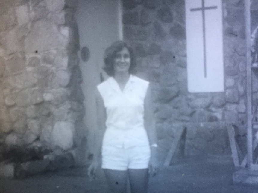 back and white photos of a teenage girl in the 196os in the front of a stone building