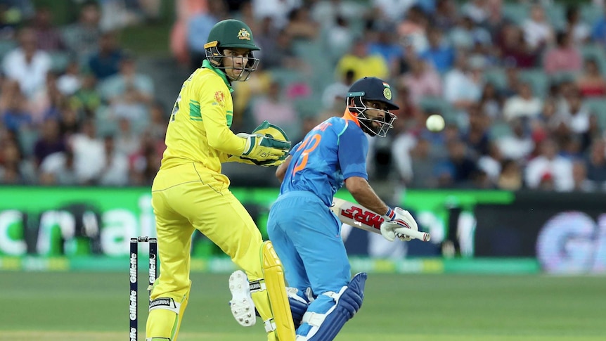 Virat Kohli steers the ball past keeper Alex Carey at the Adelaide Oval