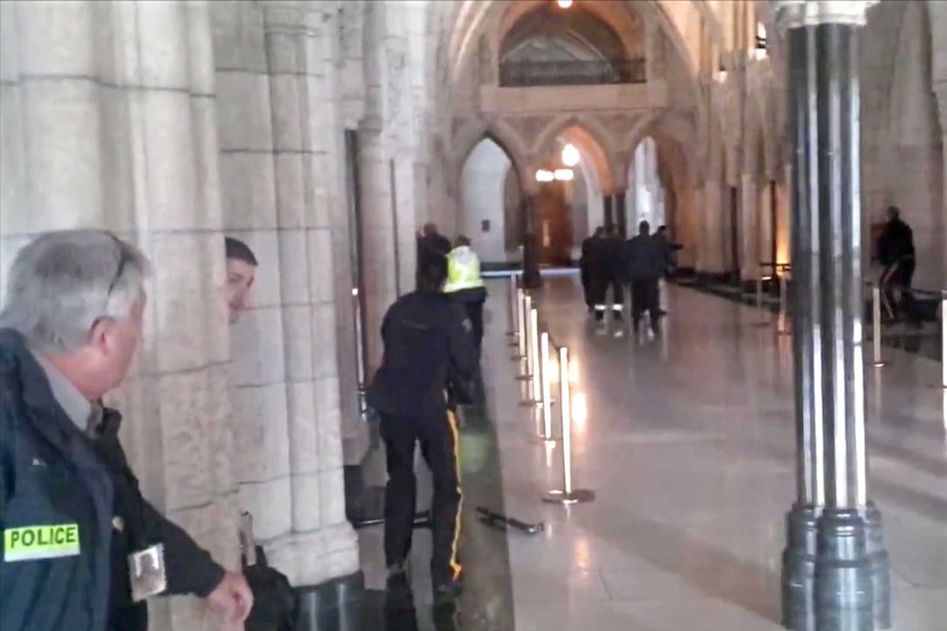 Guards at Canadian Parliament rush and kill gunman