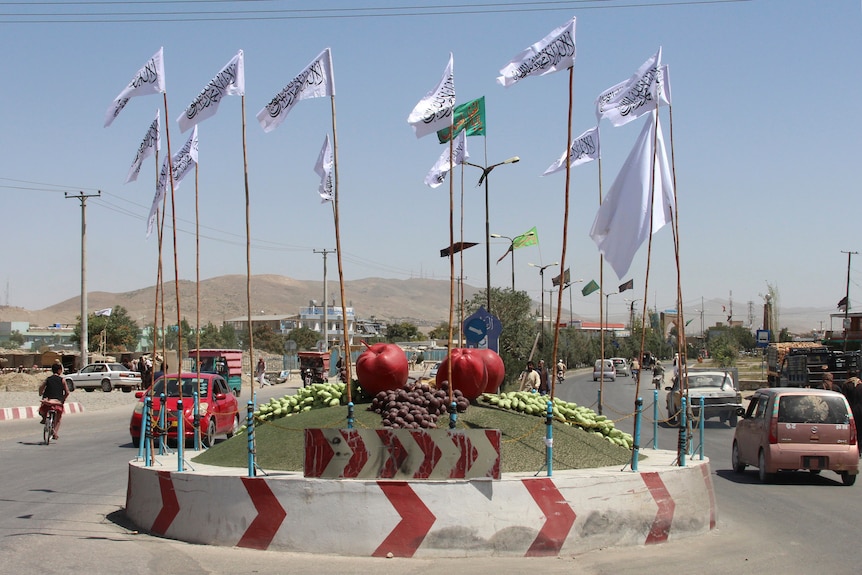 Taliban flags fly at a square in the city of Ghazni, southwest of Kabul