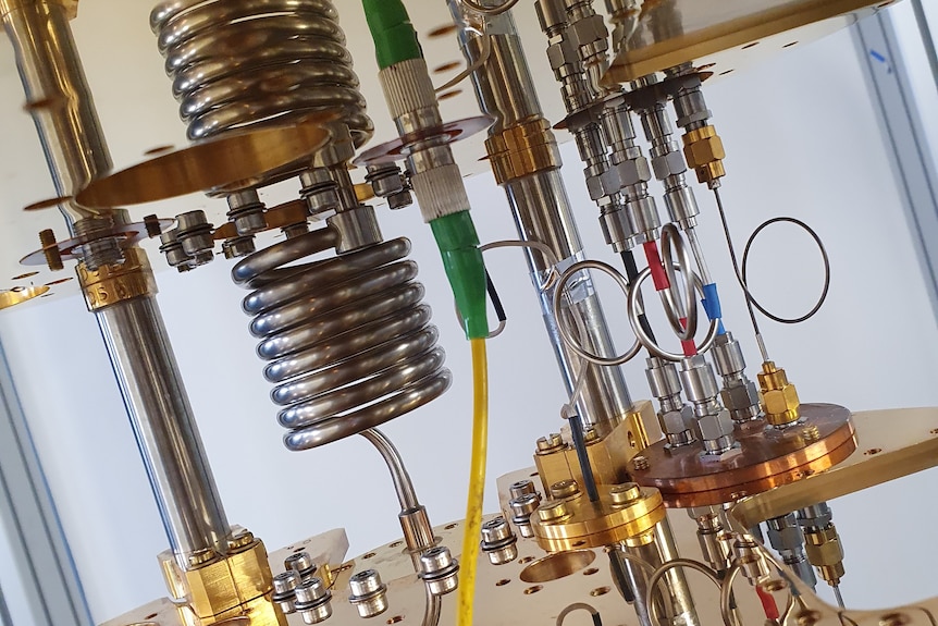 Shiny coils and pipes form part of a super cold quantum refrigerator. 