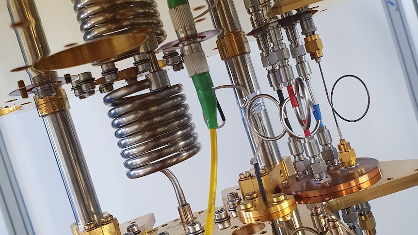 Shiny coils and pipes form part of a super cold quantum refrigerator. 