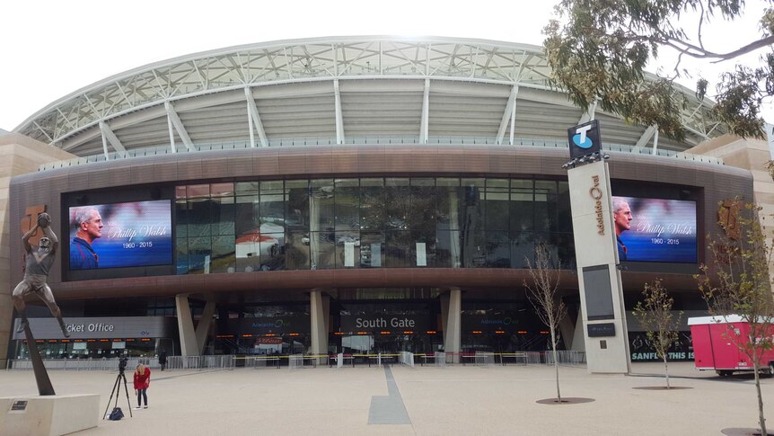 Tribute to Phil Walsh on the screens outside Adelaide Oval