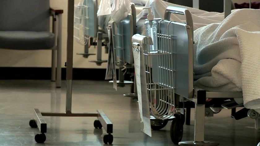 A row of patient beds in a hospital.