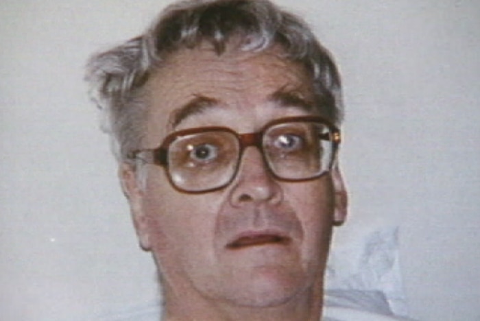 John Flynn in a hospital bed.