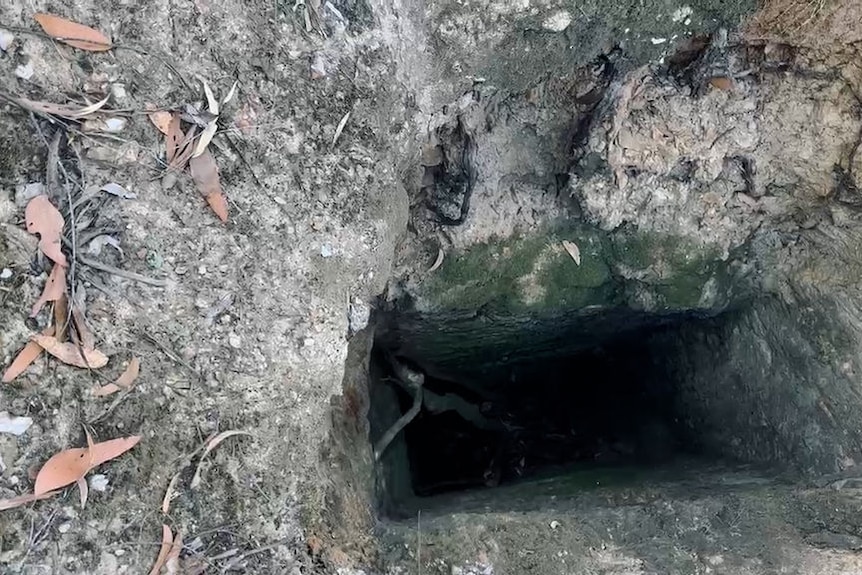 A top-down look into a small mine shaft.