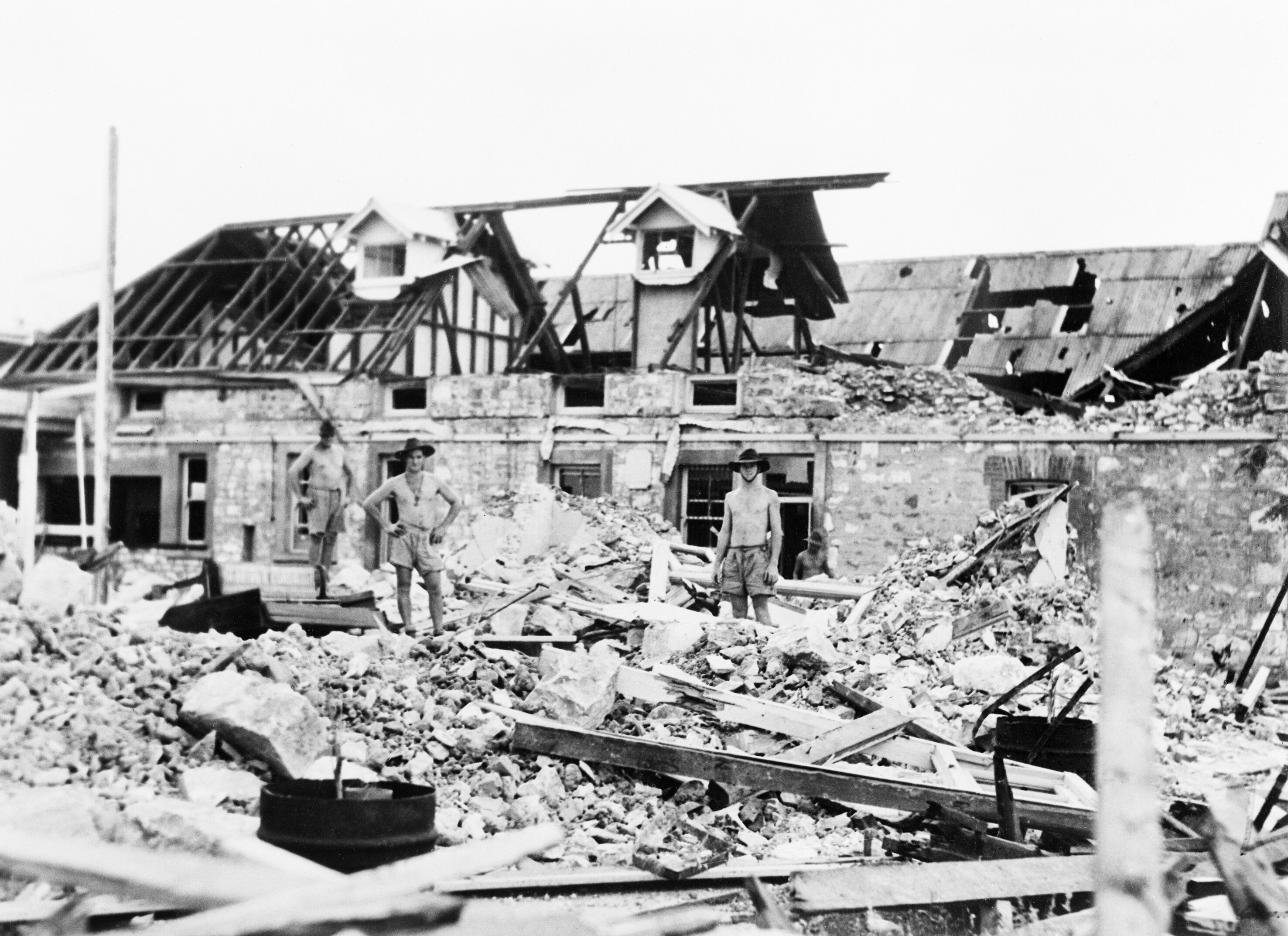Darwin, NT. February 1942. Australian troops inspect bomb damage caused by Japanese air raids. 042870