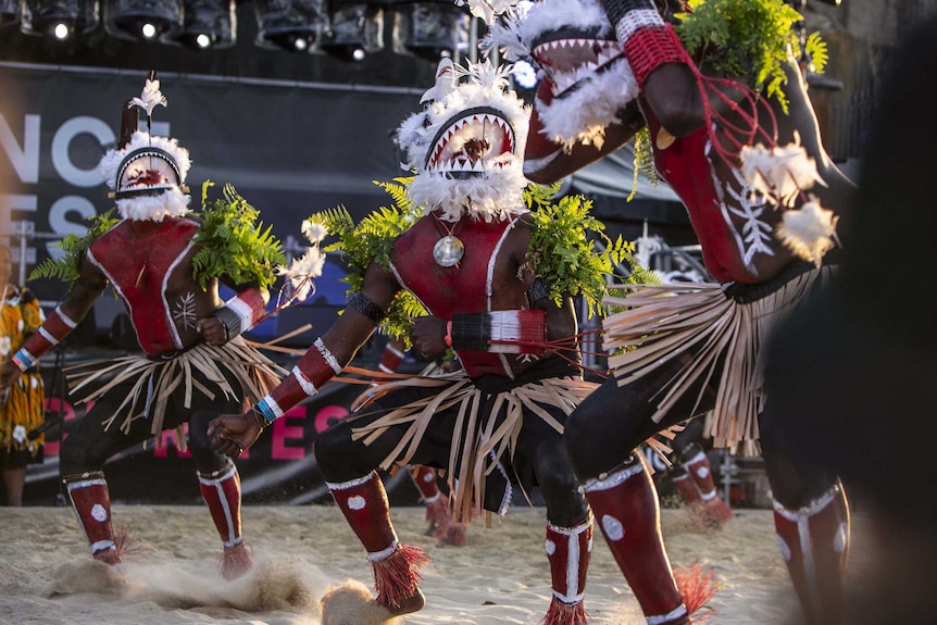 Colour photo of Meuram Murray Island Dancers performing in sand circle during Dance Rites finals.