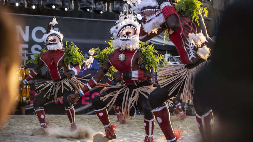 Colour photo of Meuram Murray Island Dancers performing in sand circle during Dance Rites finals.