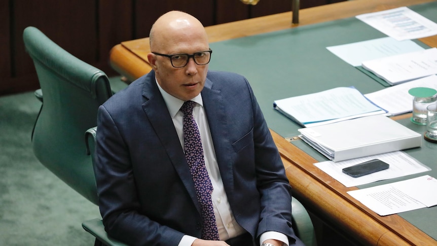 Peter Dutton sitting in the opposition leader's char in the house of representatives