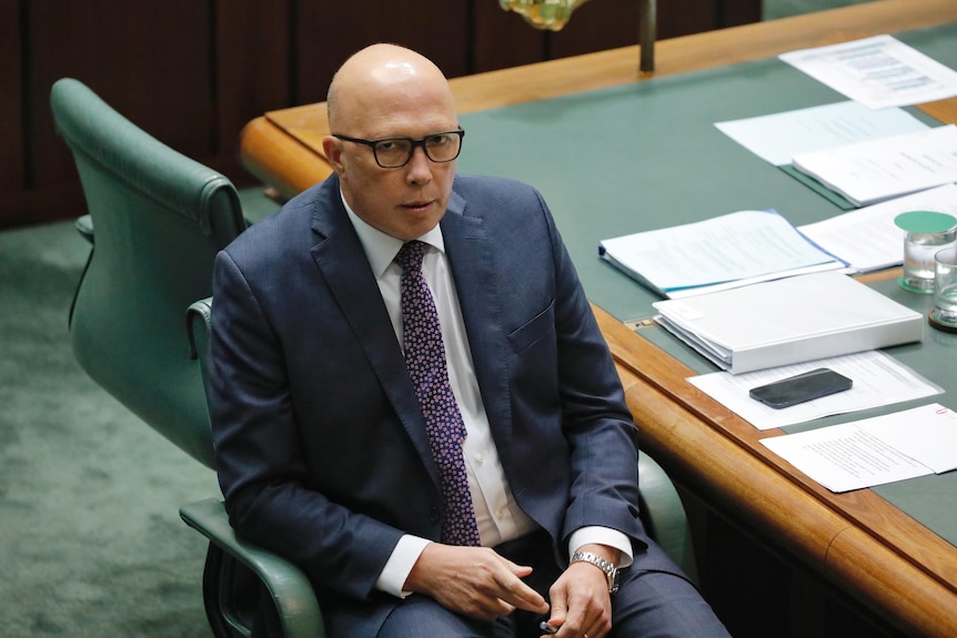 Peter Dutton sitting in the opposition leader's char in the house of representatives
