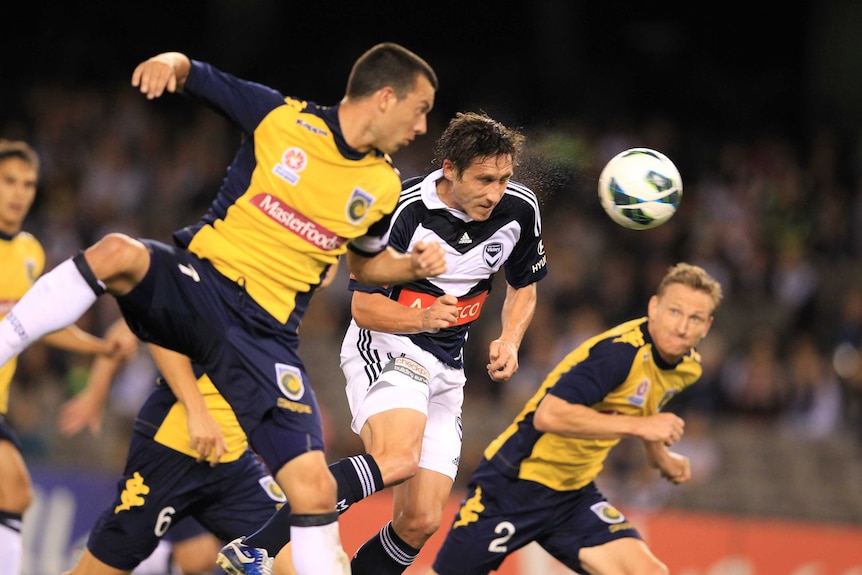 All square ... Mark Milligan levels the match for the Victory.