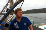 Squid fishermen Dane Van der Neut on his fishing boat.