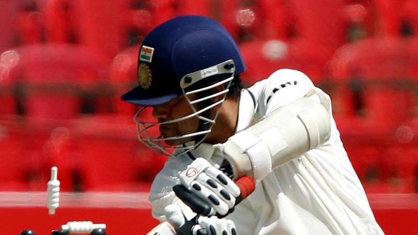 India's Sachin Tendulkar is bowled by Australia's Peter George for 214