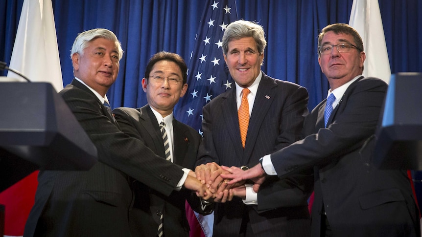 Japanese and US officials shake hands