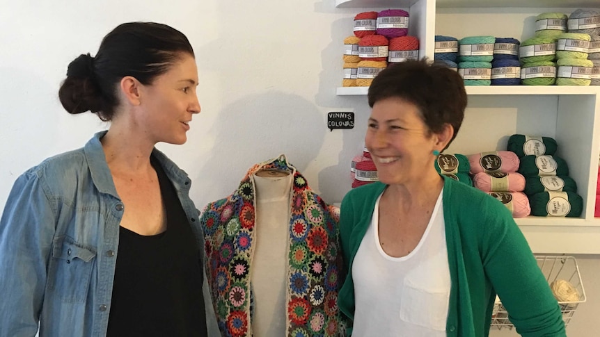 Mandy O'Sullivan (left) and Robyn Hicks stand in their yarn business.