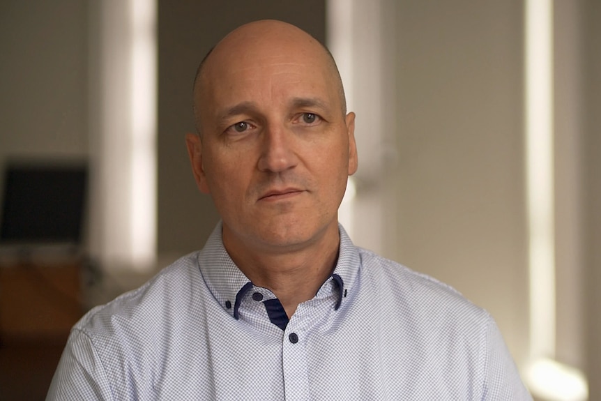 A man wearing a collared shirt.