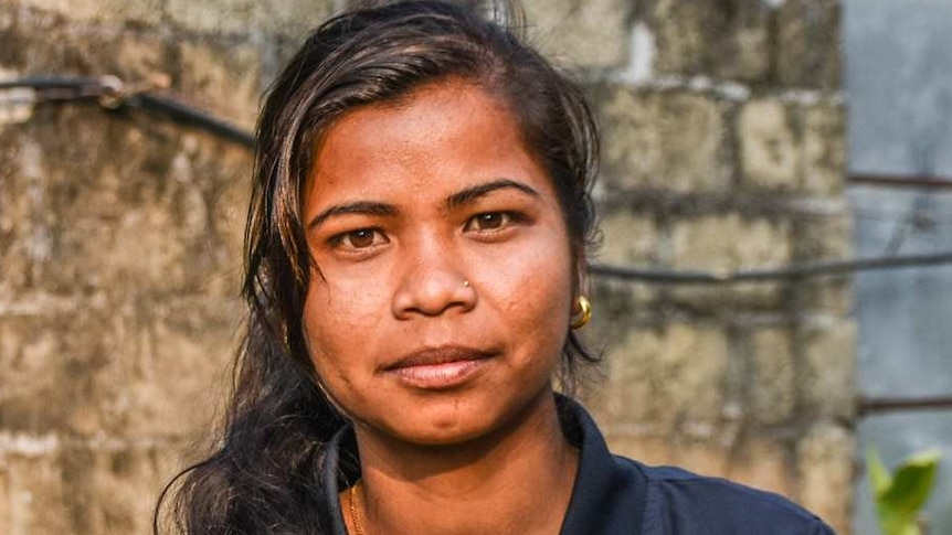 Maheshwori Nepali, a border guard with the NGO 3 Angels, looks at the camera.