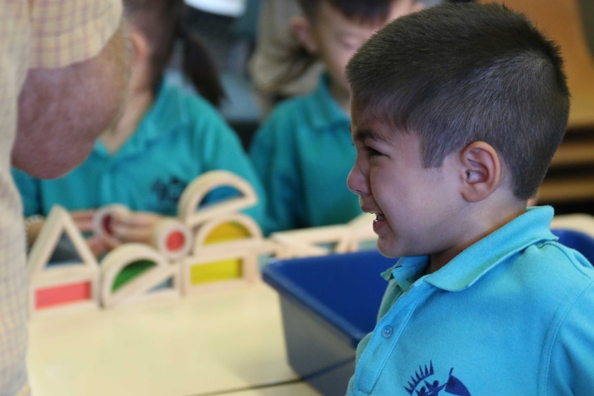 A young boy cries during his first day of kindergarten at Palmerston District Primary School in Canberra.