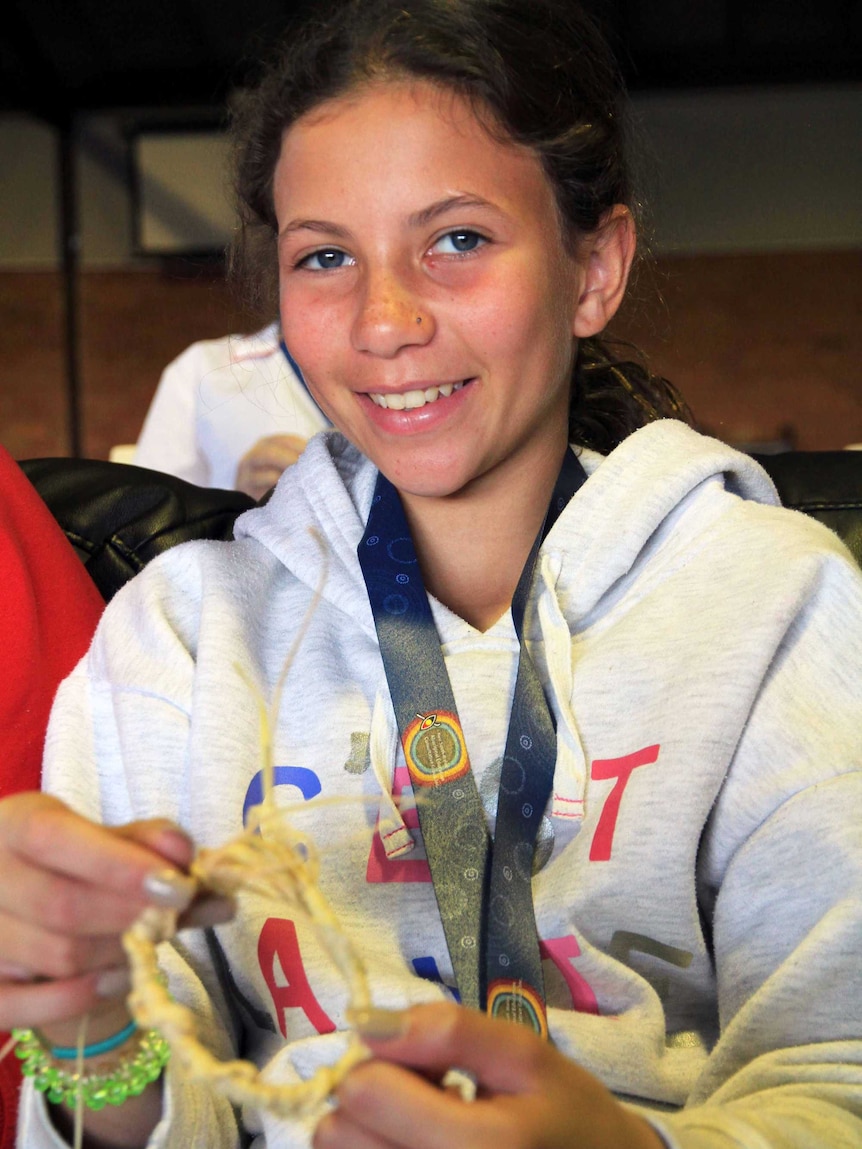 Young Wiradjuri woman Loriana Winkley from Dubbo weaving her own basket.