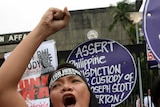 A protester shouts slogans during a rally to condemn the murder of a local transgender person