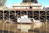Photo taken from the Murray River looking back towards the Echuca wharf and a paddlesteamer.