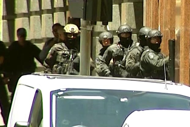 Heavily armed police gather near the Lindt Cafe
