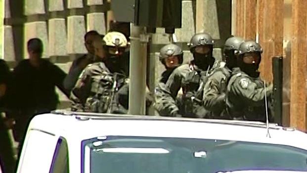Heavily armed police gather near the Lindt Cafe