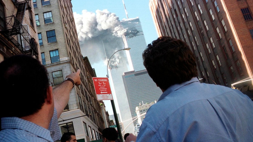 Pedestrians react on the street of New York City on September 11, 2001 (Reuters: Richard Cohen)