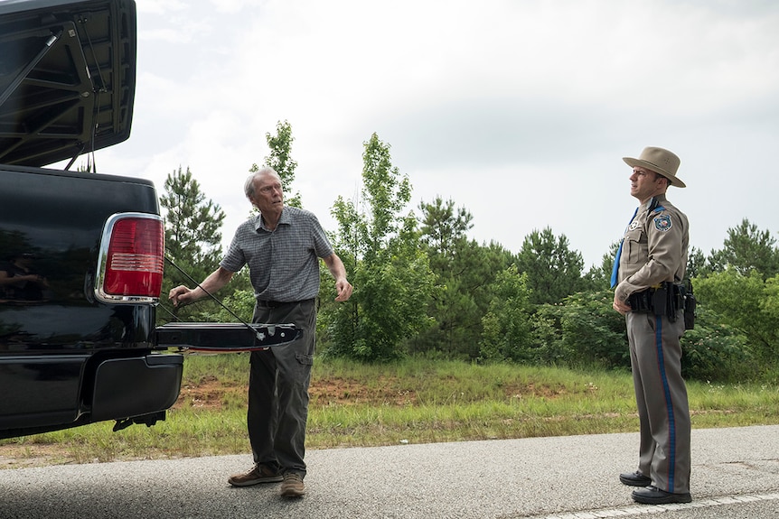 Colour still of Clint Eastwood and Alan Heckner in 2019 film The Mule.