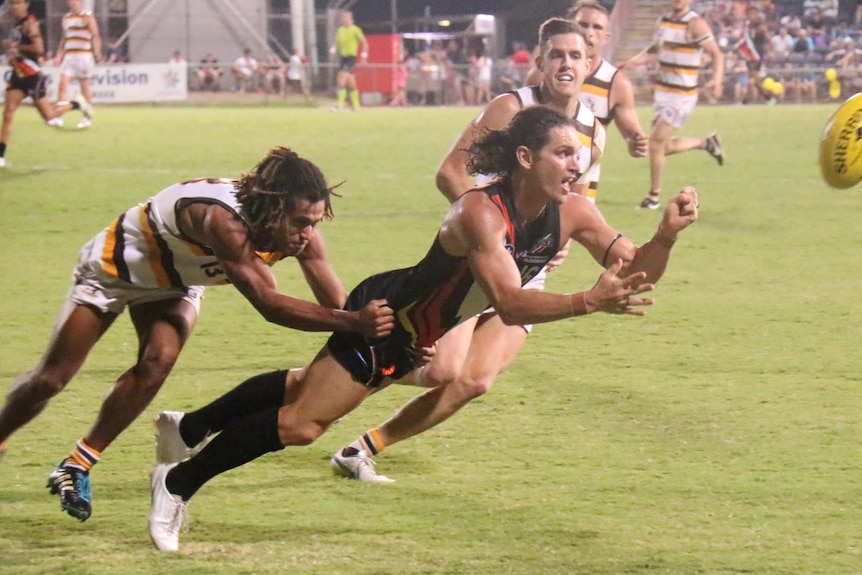 Thunder forward Cameron Ilett hand passes