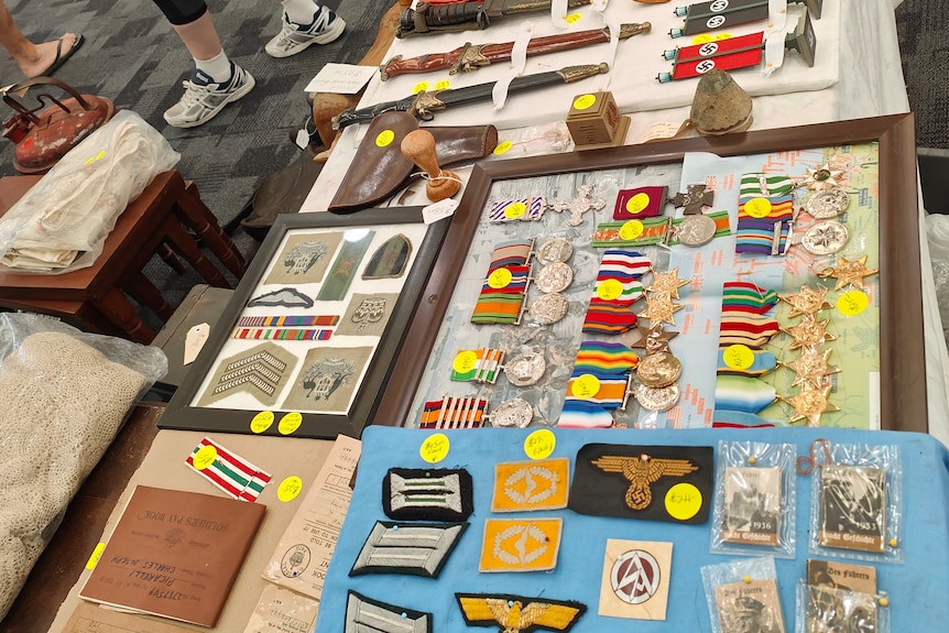 medals, flags and nazi items on a table 