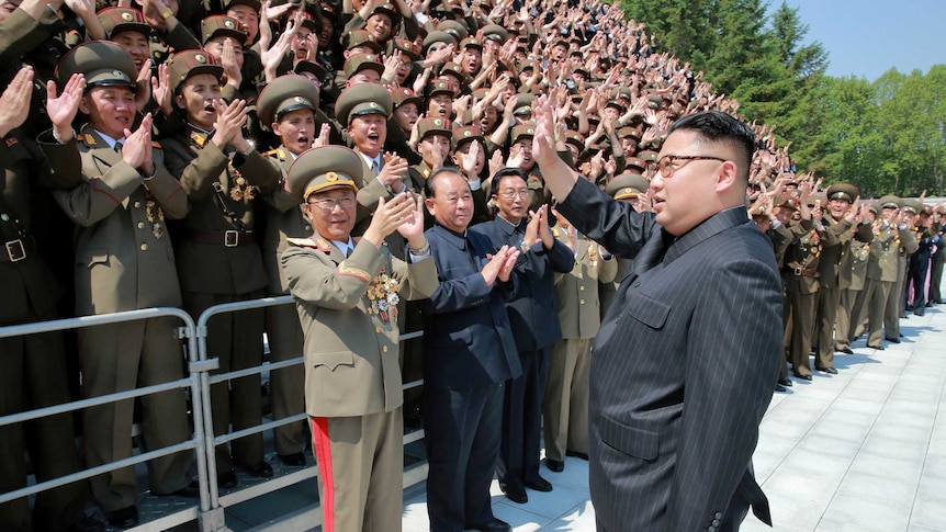 North Korean leader Kim Jong-un waves to North Korean scientists and technicians, who developed missile "Hwasong-12" in this undated photo released by North Korea's Korean Central News Agency (KCNA) May 20, 2017.