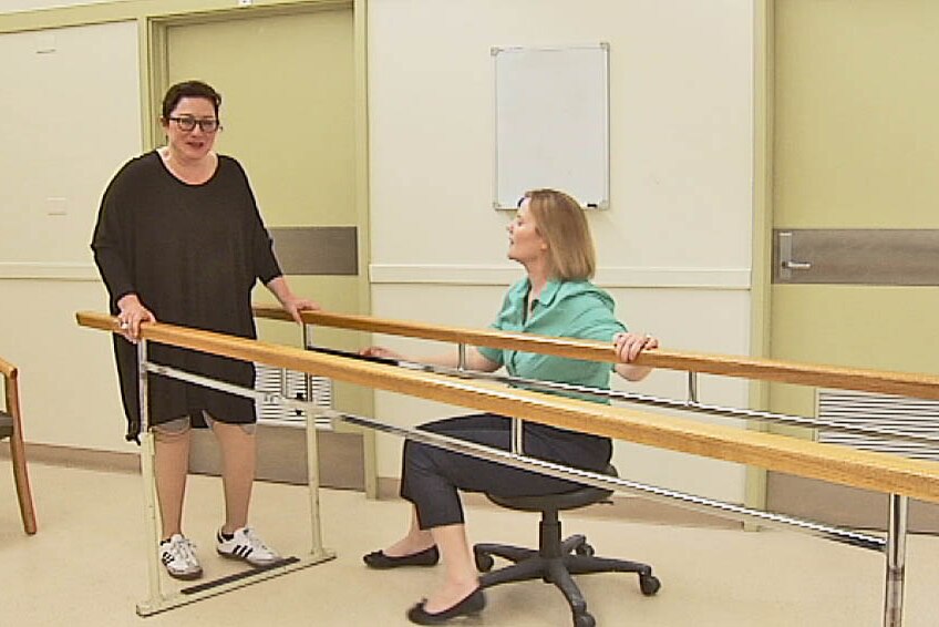 Gill Hicks tries her newest artificial legs under Sally Cavenett's expert eye