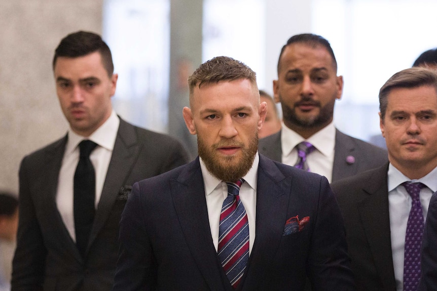 A serious looking Conor McGregor leaves a New York Courthouse