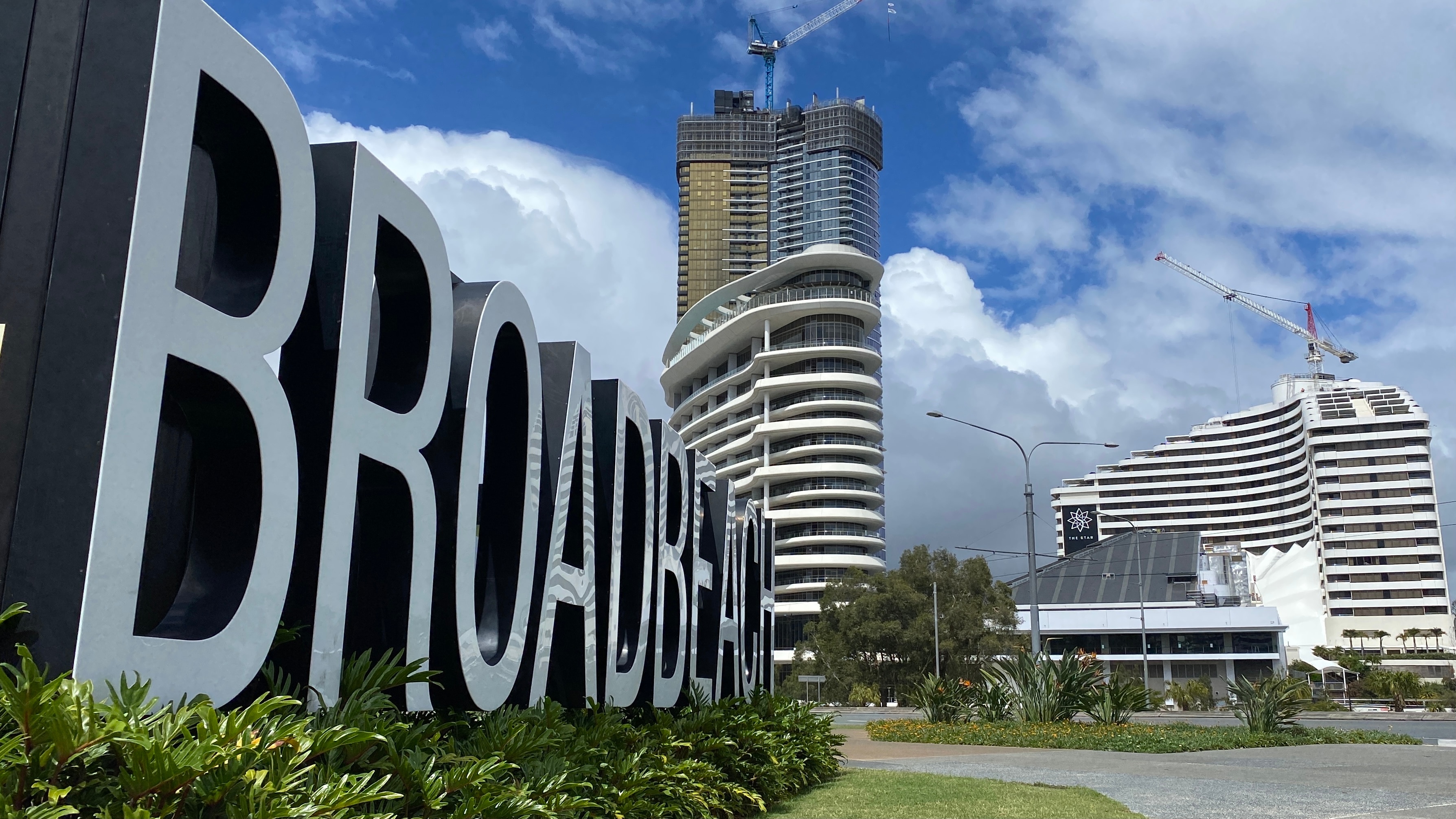 Broadbeach sign in the foreground of the Star Casino on the Gold Coast.