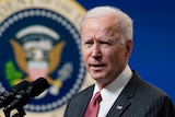 Joe Biden speaks in a suit and tie in the South Court Auditorium on the White House complex