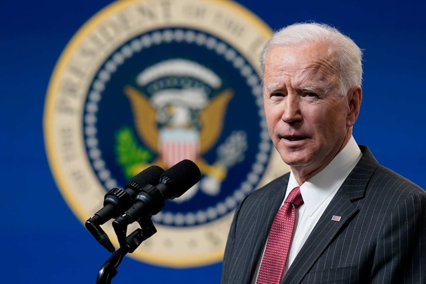 Joe Biden speaks in a suit and tie in the South Court Auditorium on the White House complex