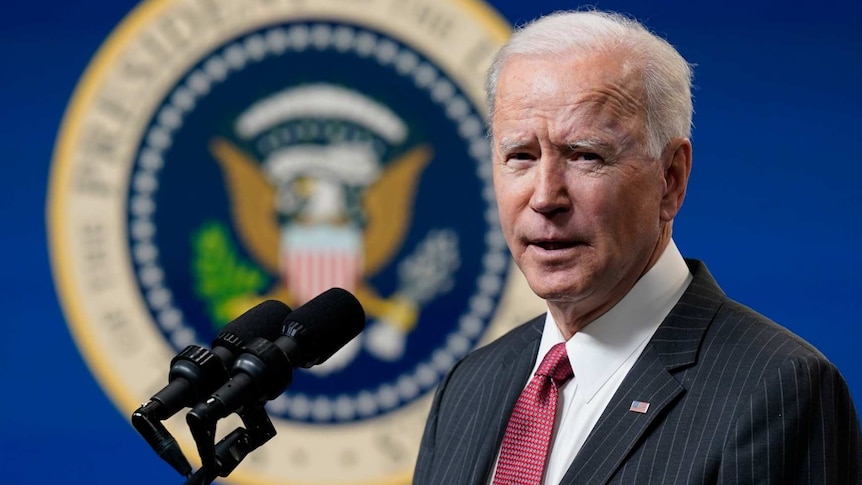 Joe Biden speaks in a suit and tie in the South Court Auditorium on the White House complex